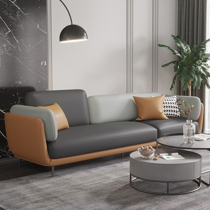 Three-seater leather sofa with metal legs