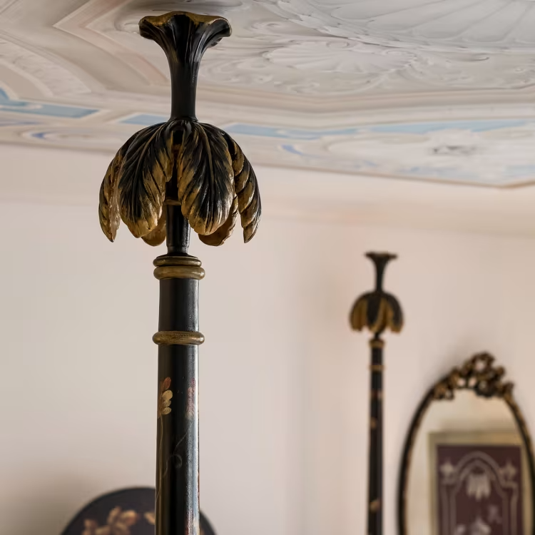 Black roma queen size bed with laurel crown