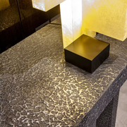 Imperfetto asymmetrical three-legged liquid metal tin console