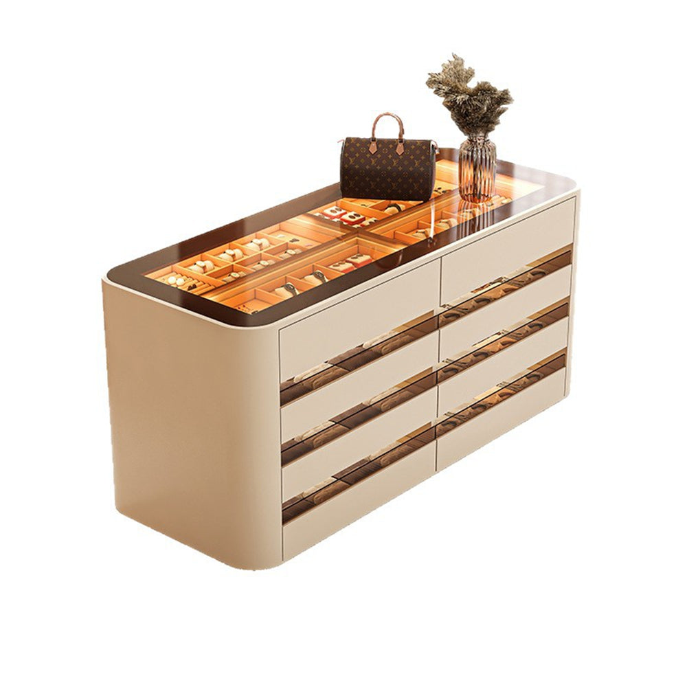 Luxury dresser with reflective surface and decorative items on a white background