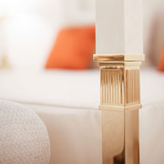 White leather and golden bronze double canopy bed