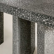 Imperfetto asymmetrical three-legged liquid metal tin console