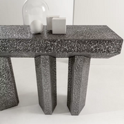 Imperfetto asymmetrical three-legged liquid metal tin console