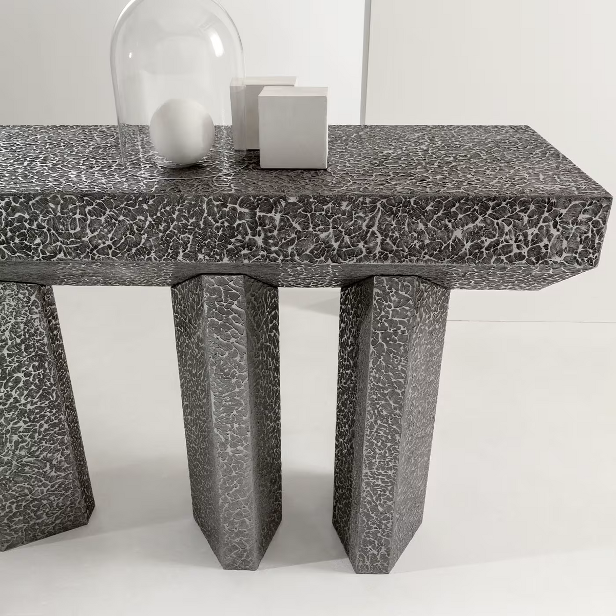 Imperfetto asymmetrical three-legged liquid metal tin console
