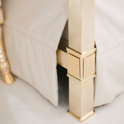 White leather and golden bronze double canopy bed